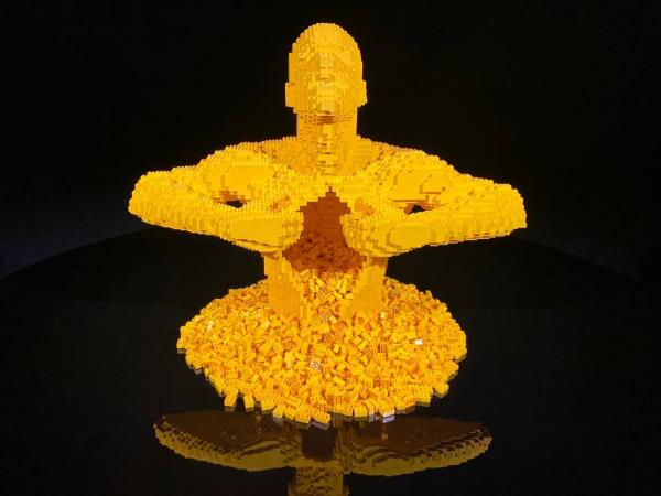 The Lego sculpture “Yellow,” by Nathan Sawaya, now on view in a Raleigh gallery