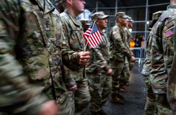NEW YORK, NEW YORK - NOVEMBER 11: Members of the military march in the annual Veterans Day Parade on November 11, 2022 in New York City. Despite the rain, hundreds of people lined 5th Avenue to watch the biggest Veterans Day parade in the United States. This years event included veterans, active soldiers and dozens of school groups participating in the parade which ho<em></em>nors the men and women who have served and sacrificed for the country.(Photo by Spencer Platt/Getty Images)
